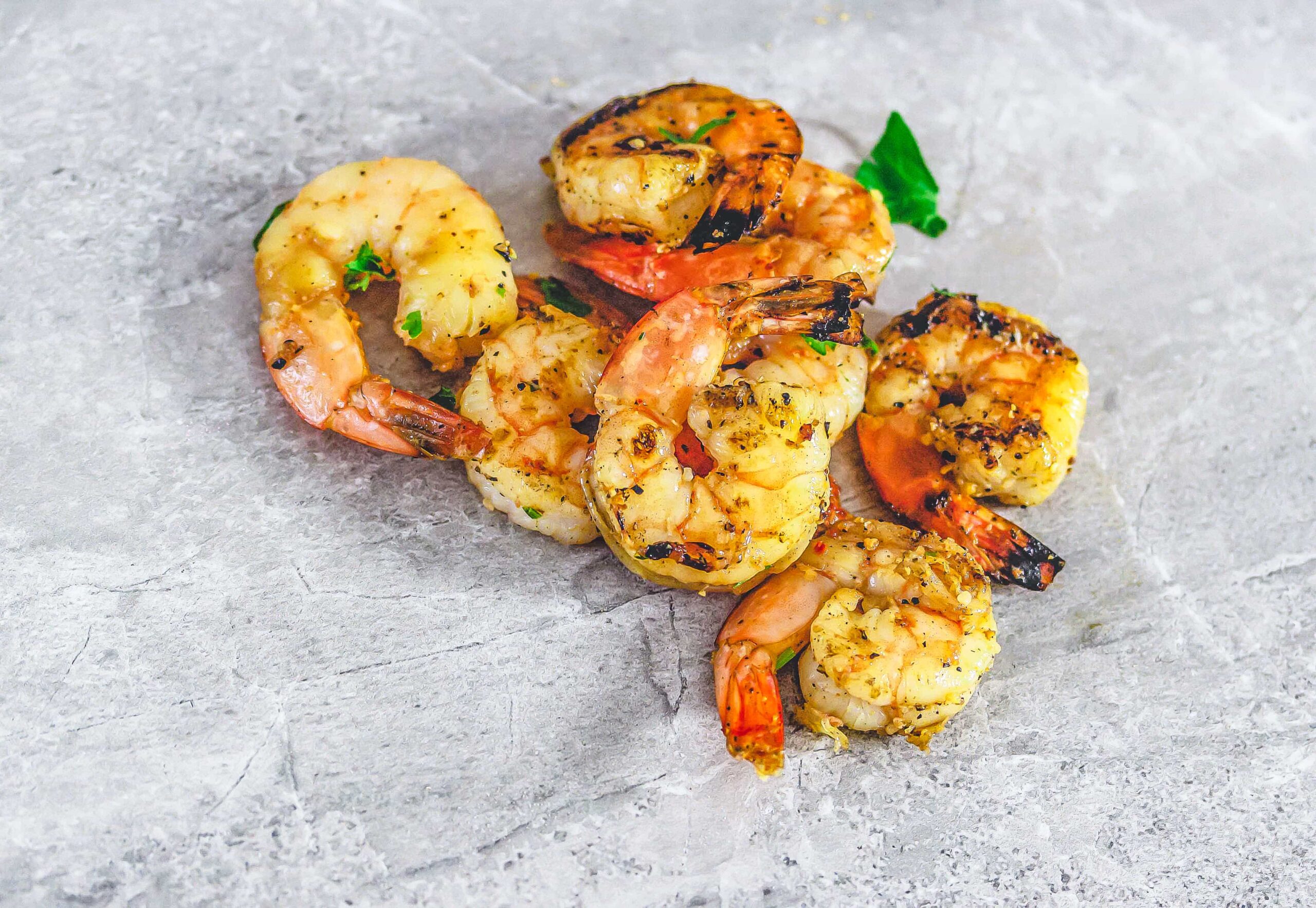 French Onion Grilled Shrimp on grey marble surface