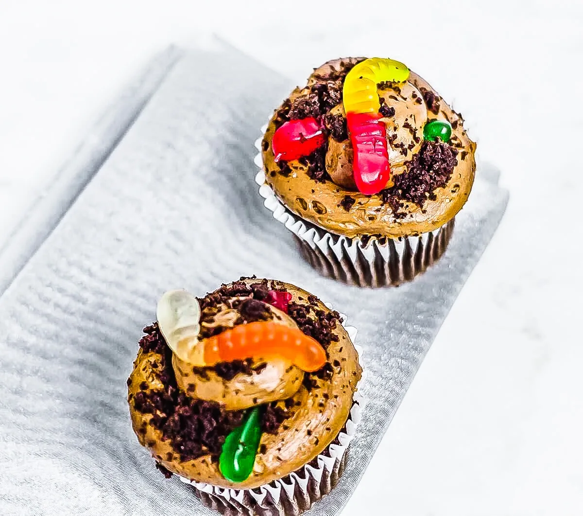 top view of oreo dirt cupcakes on grey cloth