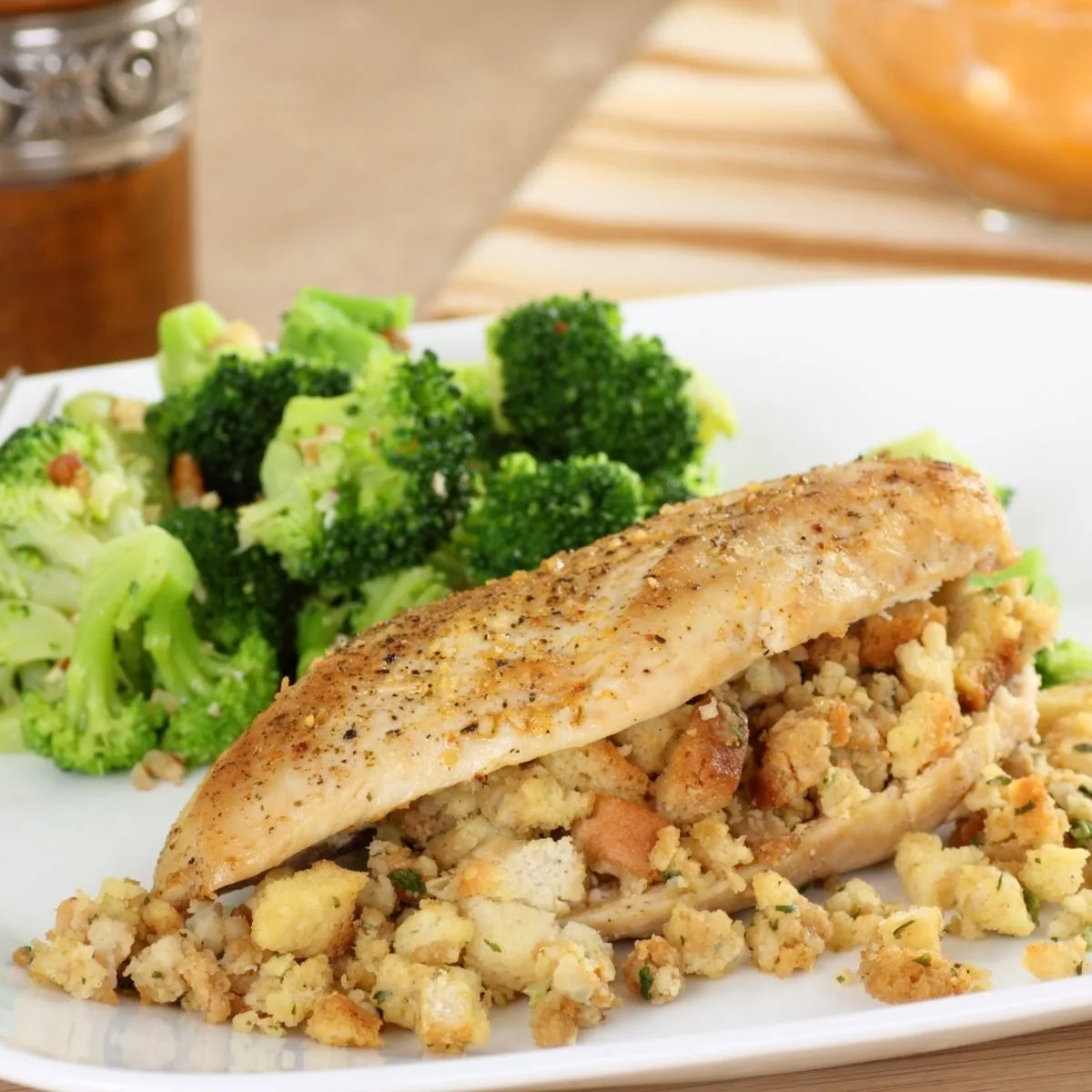 Apple Stuffed Chicken Breast on white plate with broccoli