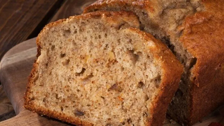 Pear Raisin Bread on wood cutting board on wood table