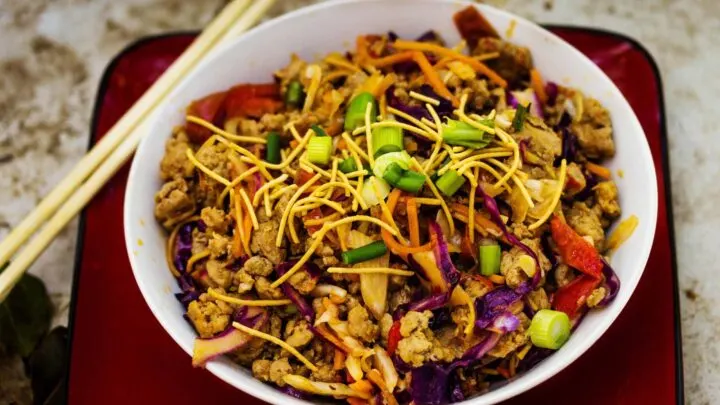 Pork Spring Roll Bowl {Simple One Dish Meal} Thai Spring Roll Bowl in white bowl and chopsticks on red plate